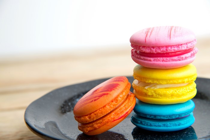 Stack of colorful macarons on a plate