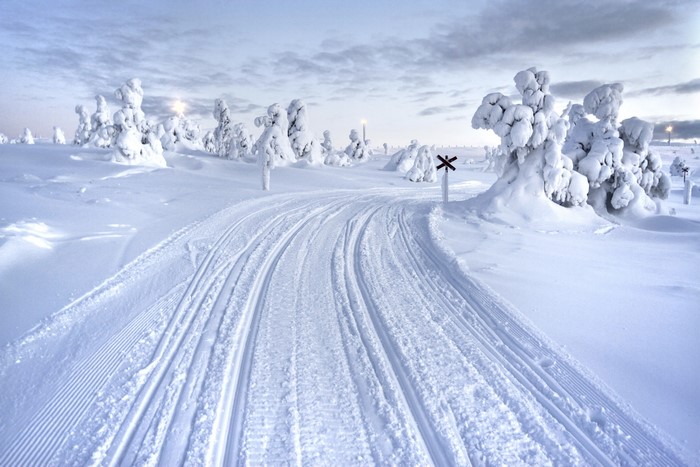 Snowy road in Lapland, Finland during winter