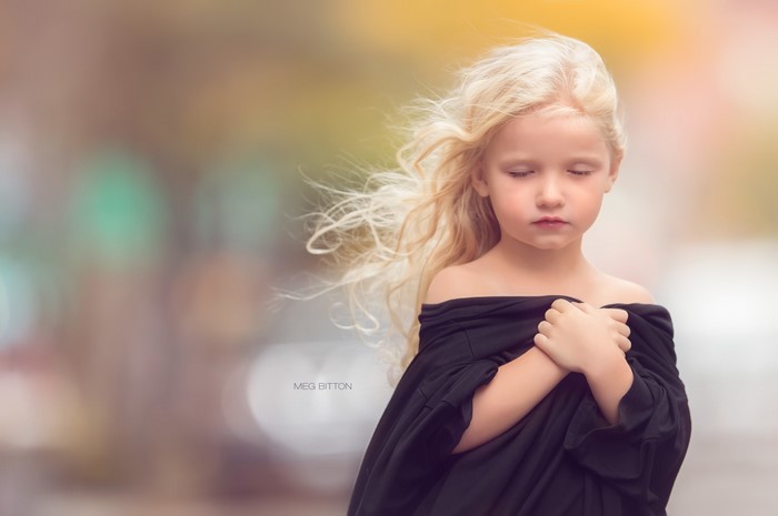 Blonde girl with eyes closed