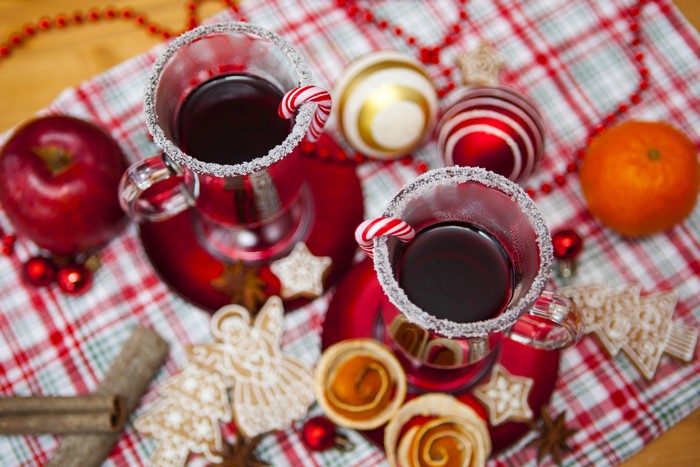 Christmas mulled wine with candy canes and cookies