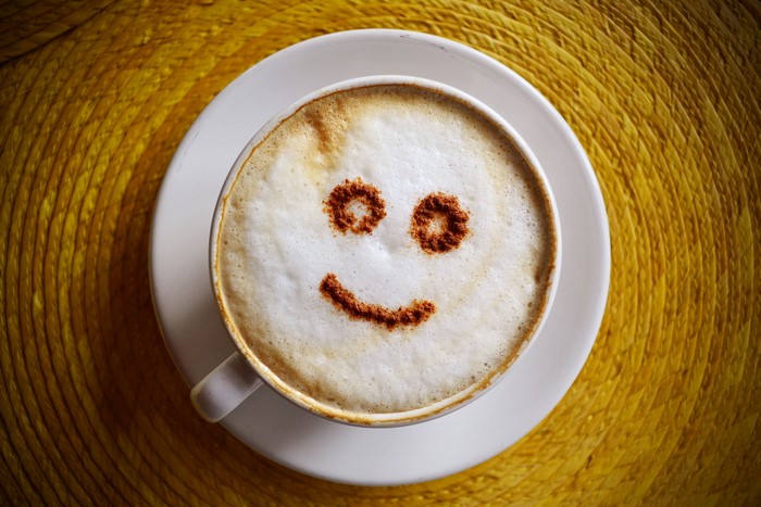 Cappuccino with a smiley face made of cinnamon