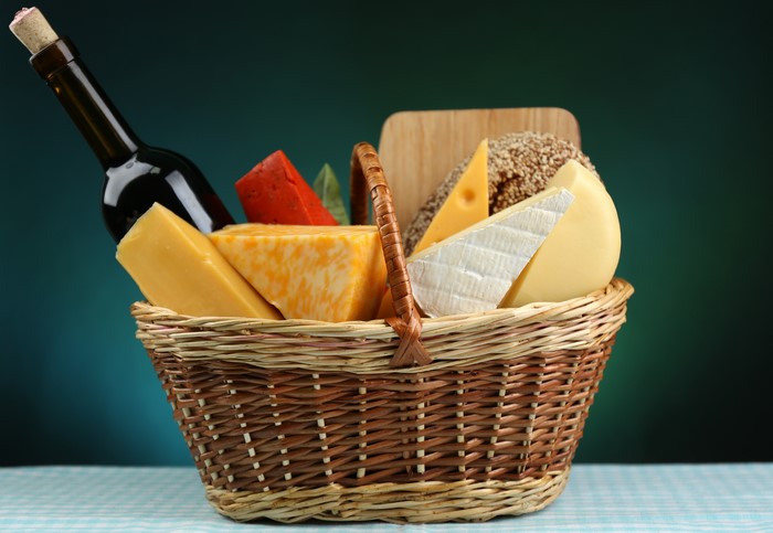Cheese and wine in a wicker basket