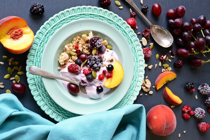 Muesli with Berries and Peaches on a Plate