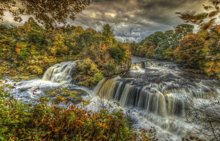 Waterfalls in Clyde Valley Woodlands, Scotland during Autumn