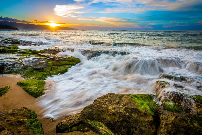Hawaii Coastline at Sunset with Waves Crashing on Rocks