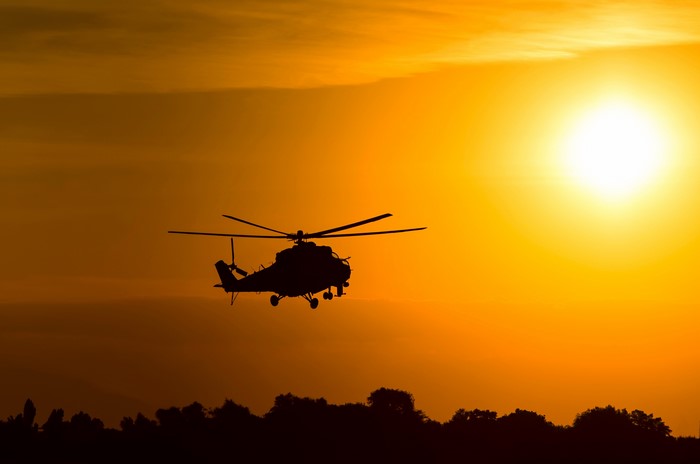 Silhouette of Mil Mi-24 Helicopter at Sunset