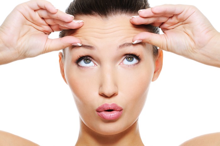 Woman showing forehead wrinkles