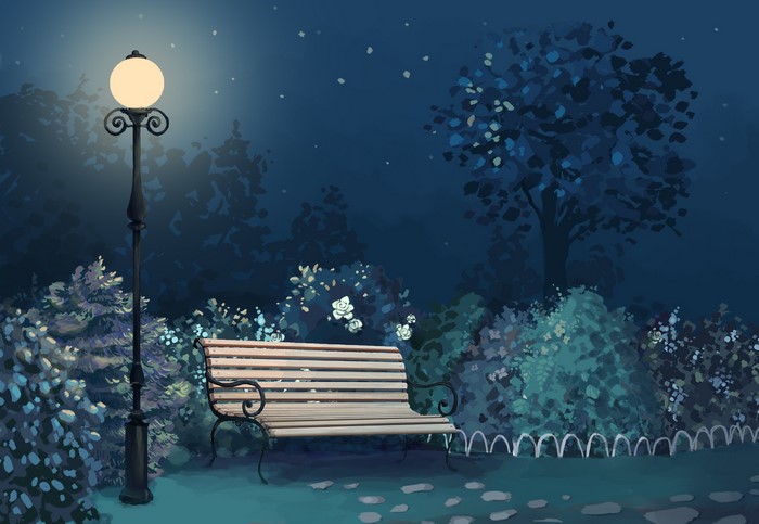 Park bench under a street light at night