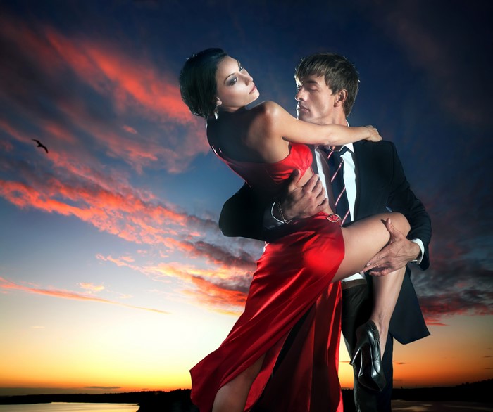 Couple dancing at sunset