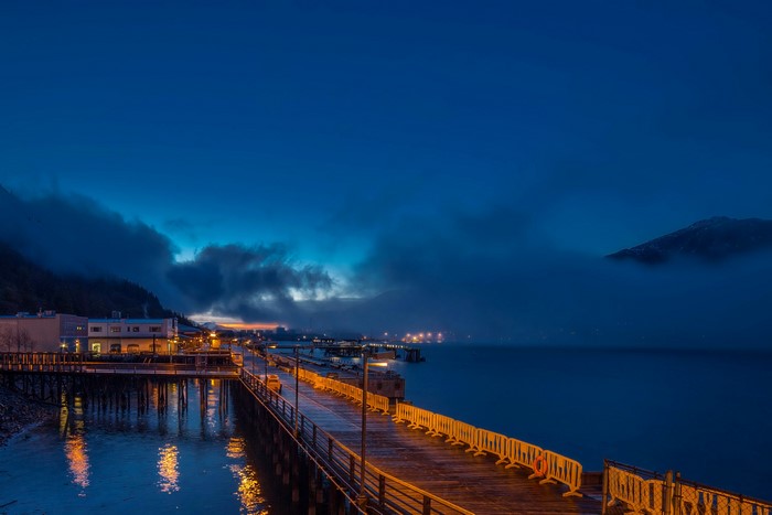 Juneau, Alaska waterfront at dusk with pier and fog