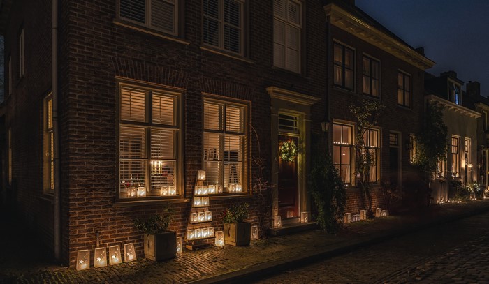 Christmas lanterns on a street in Buren, Netherlands at night