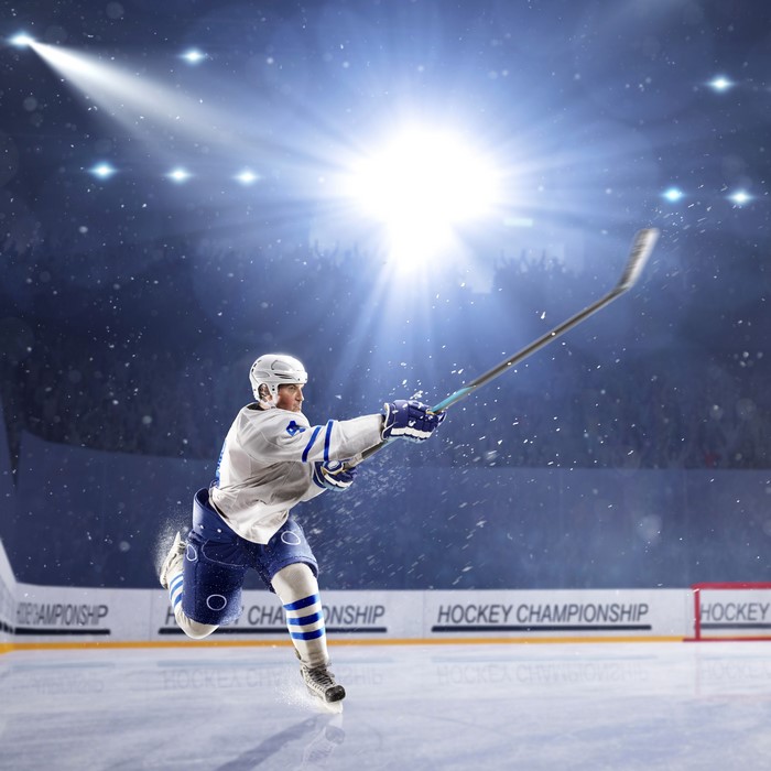 Hockey player in uniform on ice rink