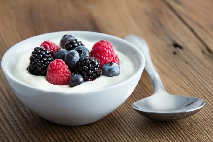 Bowl of yogurt with berries and a spoon