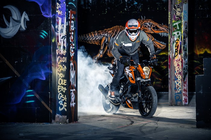 Motorcyclist performing a stunt on a KTM 125 Duke
