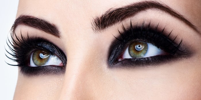 Closeup of a woman's eyes with dramatic black makeup