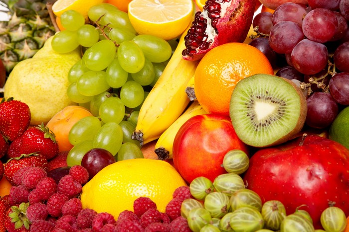 Assortment of fresh fruits including grapes, strawberries, and kiwi