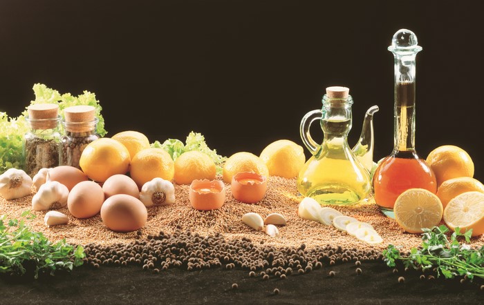 Still-life of lemons, eggs, garlic, and spices