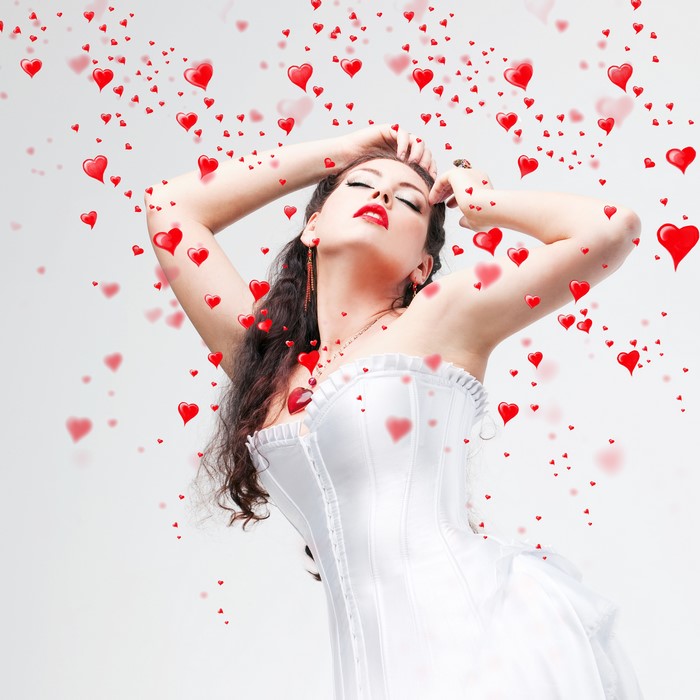 Woman in white corset with falling hearts