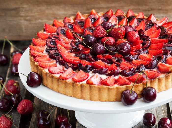 Strawberry and Cherry Tart on a White Stand