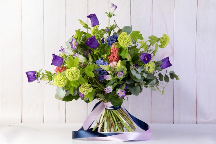 Bouquet of Campanula flowers with ribbons