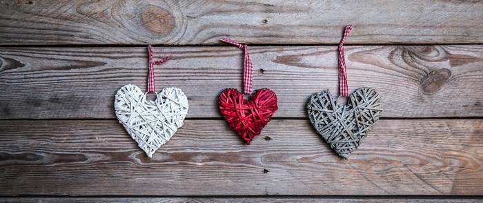 Three hearts on wood planks