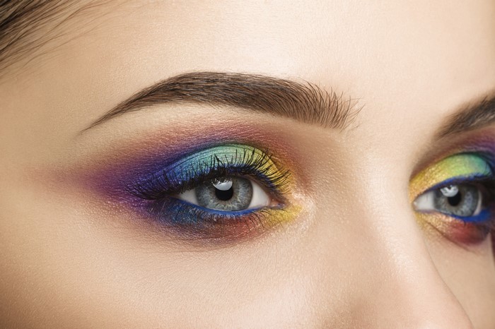Close-up of a woman's eyes with colorful makeup