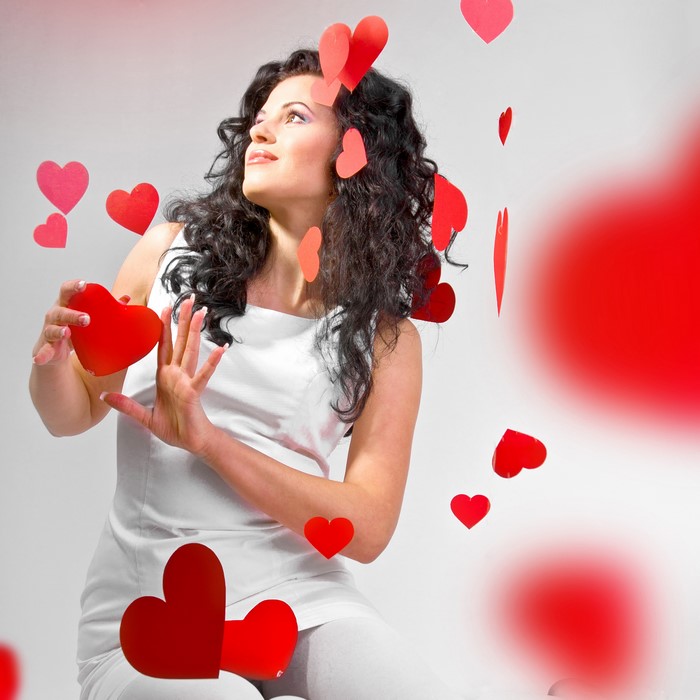 Woman with brown hair and red hearts