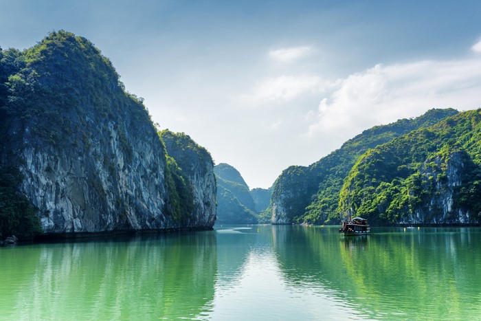 Halong Bay, Vietnam with a boat and limestone karsts