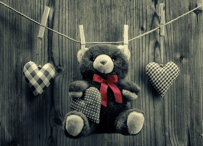 Teddy bear with hearts on a clothesline
