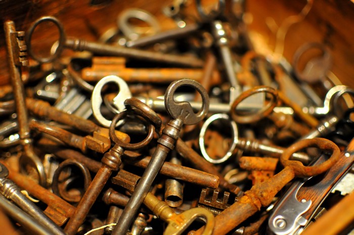 A pile of old, rusty keys