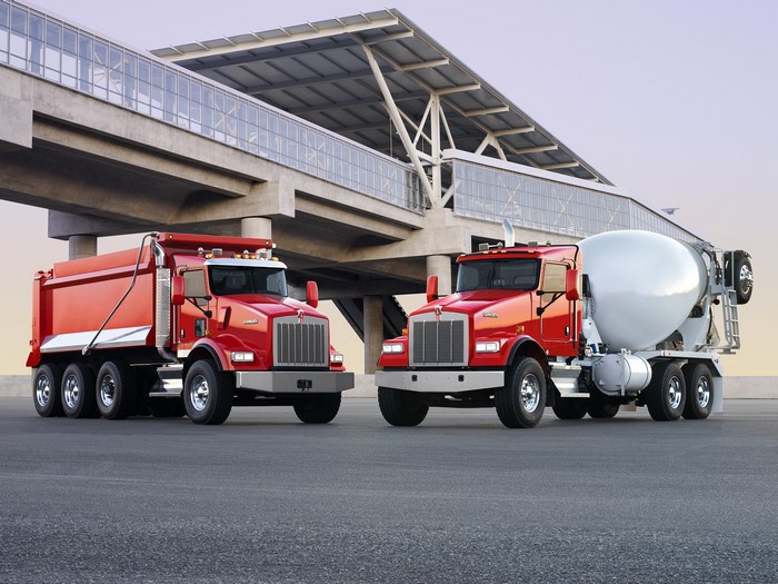 Two red Kenworth T800 trucks