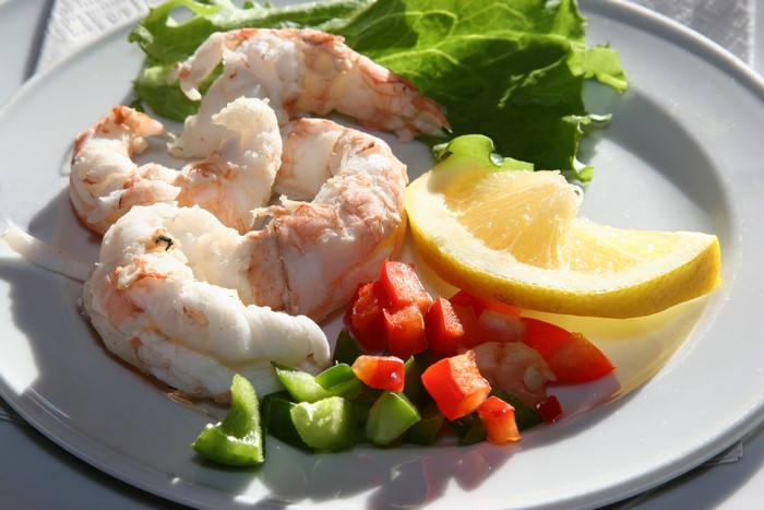 Shrimp with Lemon and Vegetables on a Plate