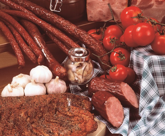 Meat products, sausages, tomatoes, and garlic