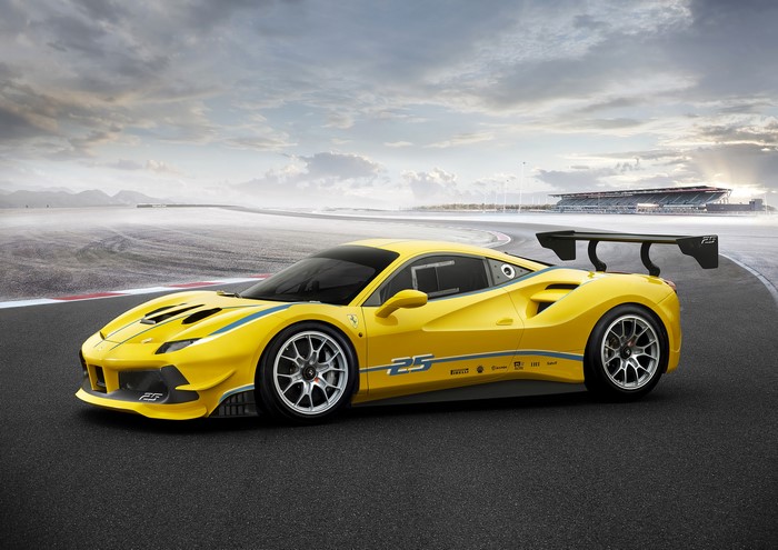 Yellow Ferrari 488 Challenge on a Racetrack