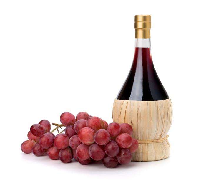 Bottle of red wine and grapes