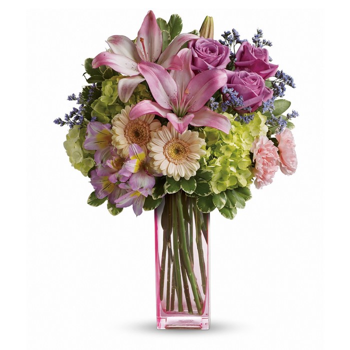 Pink and purple floral arrangement in a pink vase