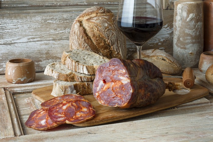 Sausage, Bread, Wine, and Cutting Board