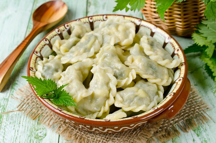 Pierogi varenyky in a bowl with a spoon