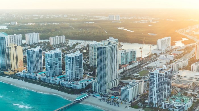 Aerial view of Miami coastline with high-rise buildings