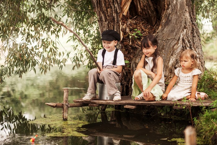 Three Children Fishing by a Tree