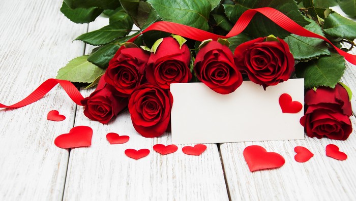 Red Roses with Blank Card and Hearts on Wood