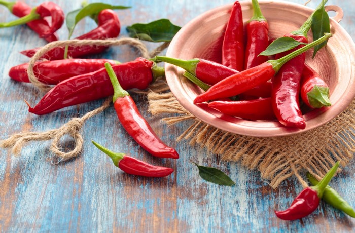 Red chili peppers in a copper bowl