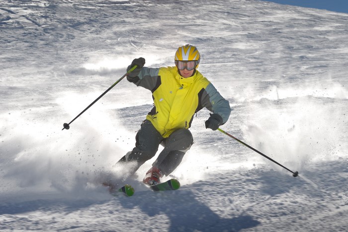 Man skiing down a snowy slope