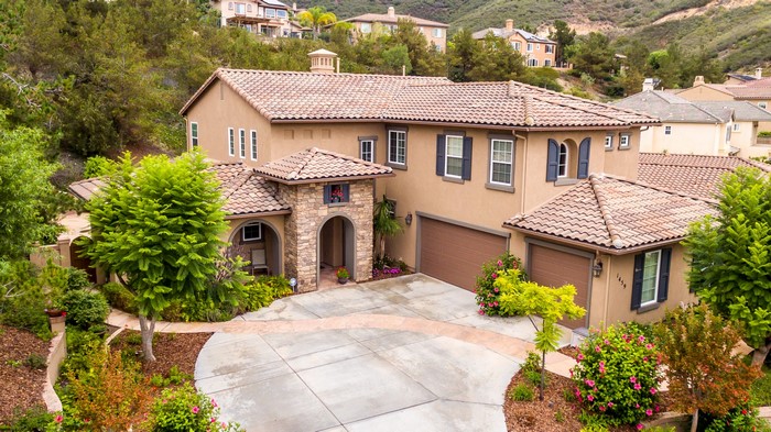 Luxury house with tiled roof and landscaping