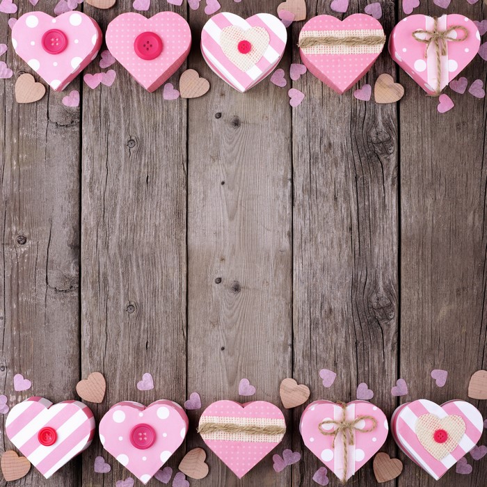 Valentine's Day heart gift boxes on wood planks