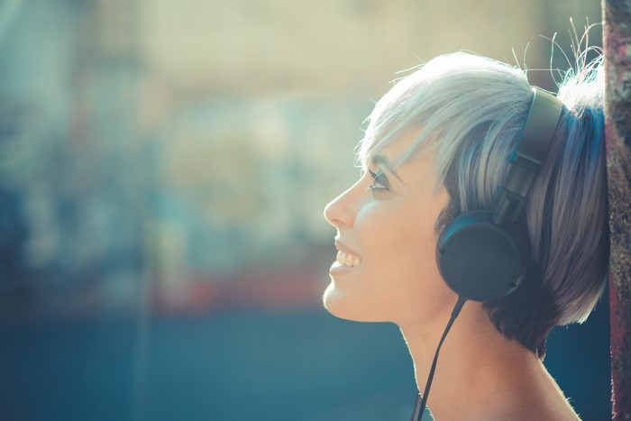 Woman with headphones listening to music