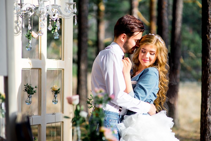 Couple hugging in a forest setting
