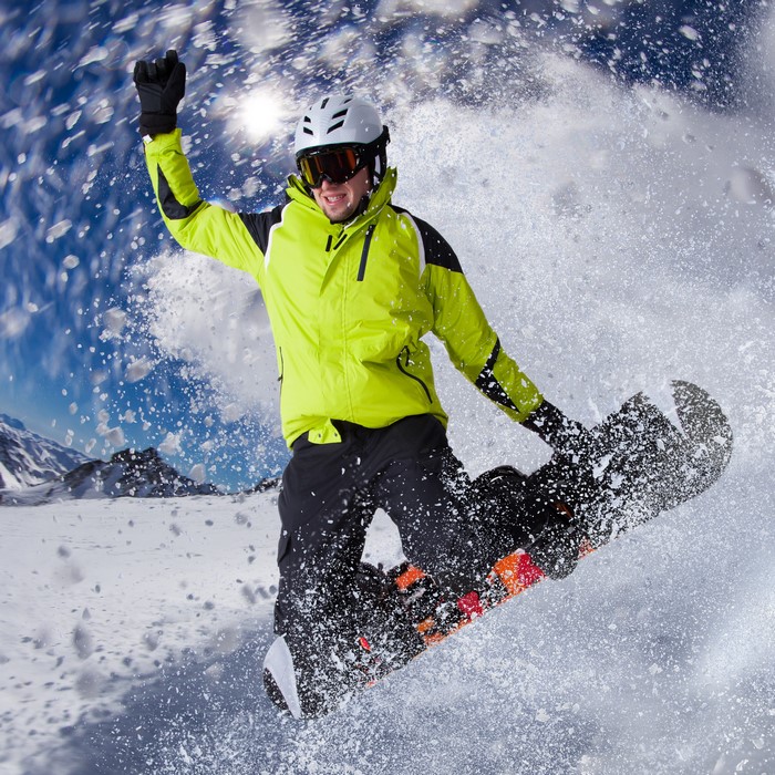 Man snowboarding and jumping in the snow
