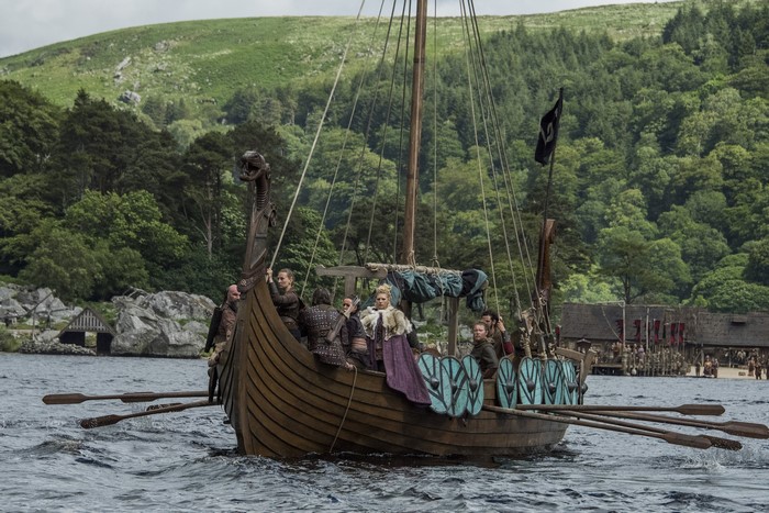 Vikings on a longship in a lake