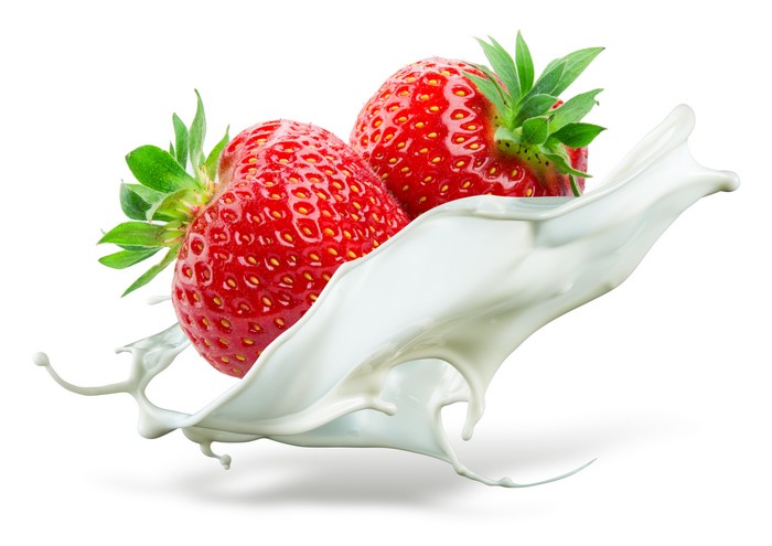Two Strawberries in Milk Splash